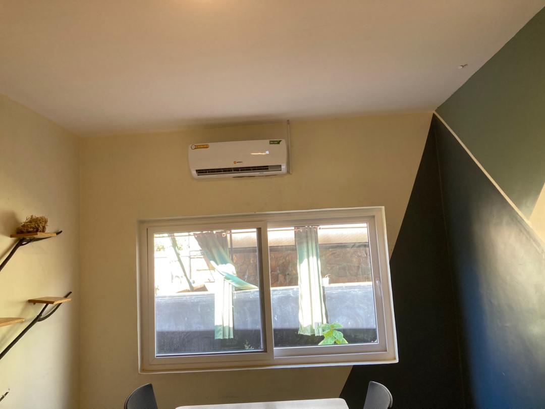 Three stacked LG outdoor AC units